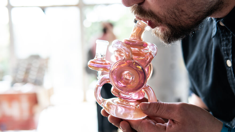 smoking from a glass bong